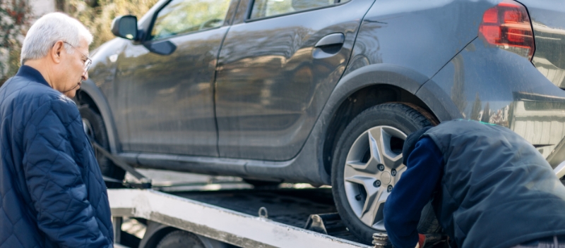 A man who donated his vehicle watches it get towed for free